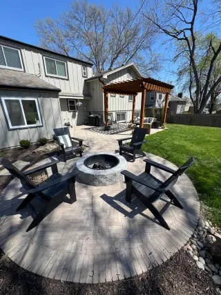 Fire pit with pergola outdoor space in Lake Quivira