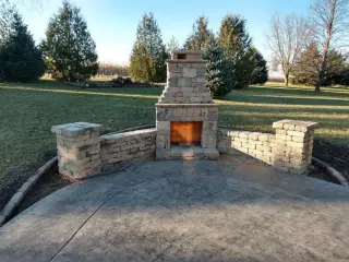 Professional concrete contractor work - driveway and patio installation in Lee's Summit, MO