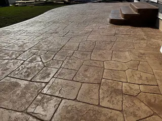 Flagstone pattern stamped concrete patio with steps in Kansas City