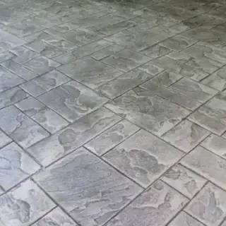Geometric stamped concrete patio design with square pattern