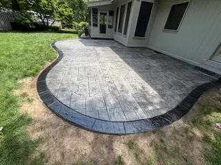 Stamped concrete patio with a contrasting colored decorative border