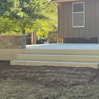Decorative concrete patio installation with integrated steps