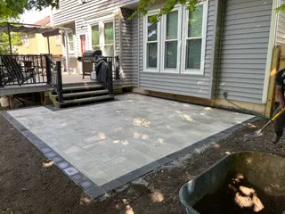 Paver and concrete patio with decorative borders in Shawnee