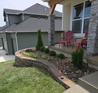 Professional concrete contractor work - front porch with retaining wall in Overland Park, KS
