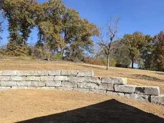 Large stone retaining wall on Lake Quivira property
