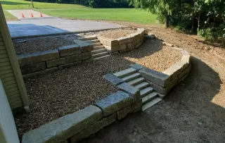 Tiered concrete steps between retaining walls in Olathe
