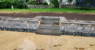 Stone retaining wall installed by Merriam concrete company