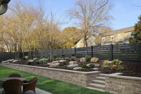 Decorative retaining wall with stone finish