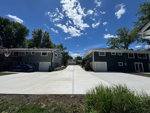 Concrete driveway providing backyard garage access