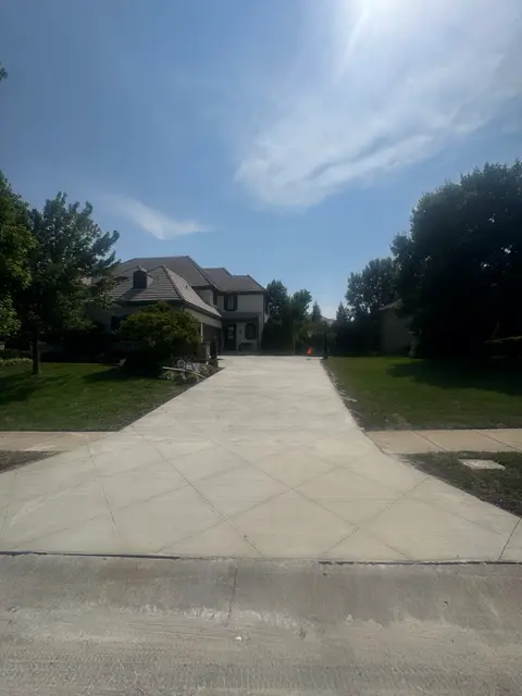 Specialty concrete driveway with diamond saw cut pattern in Leawood, KS