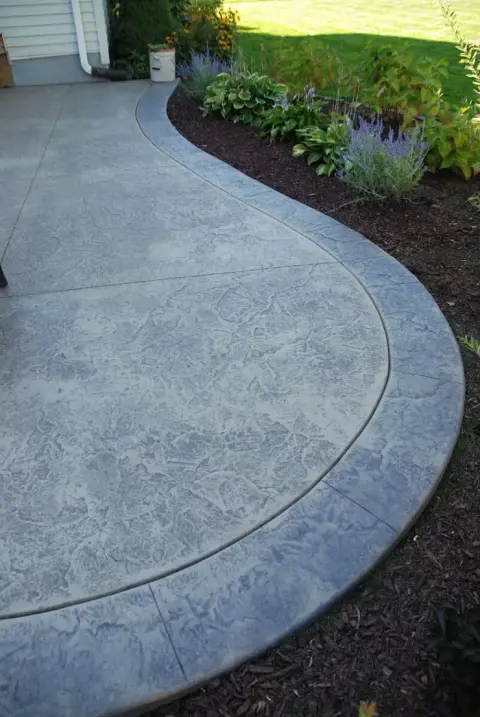 Curved stamped concrete patio design
