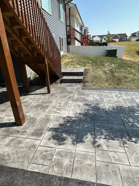 Concrete walkway steps leading to home entrance